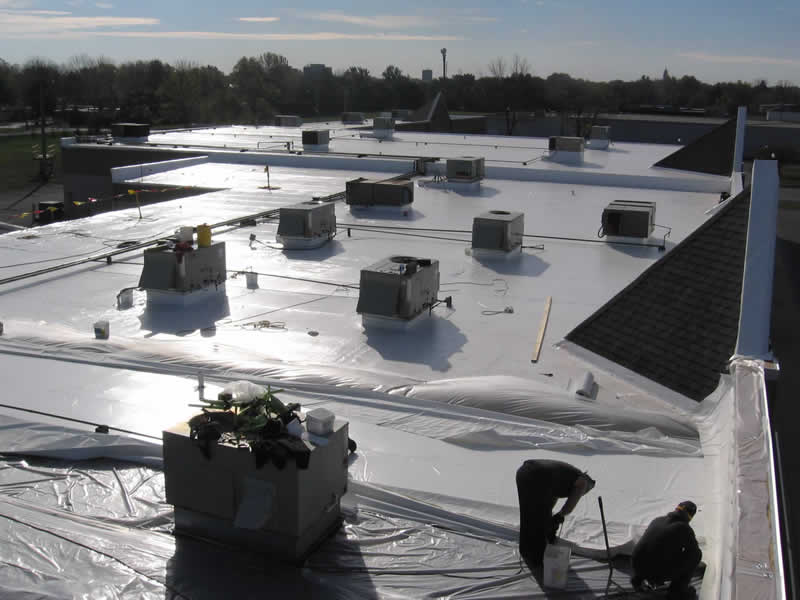 Roof removal and replacement with new Duro-last roof plastic on the roof to keep the membrane clean.jpg
